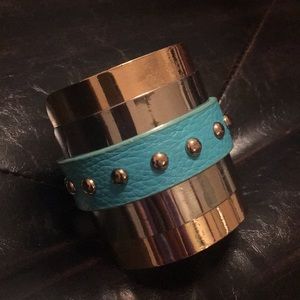 Unique leather and gold with silver tone cuff